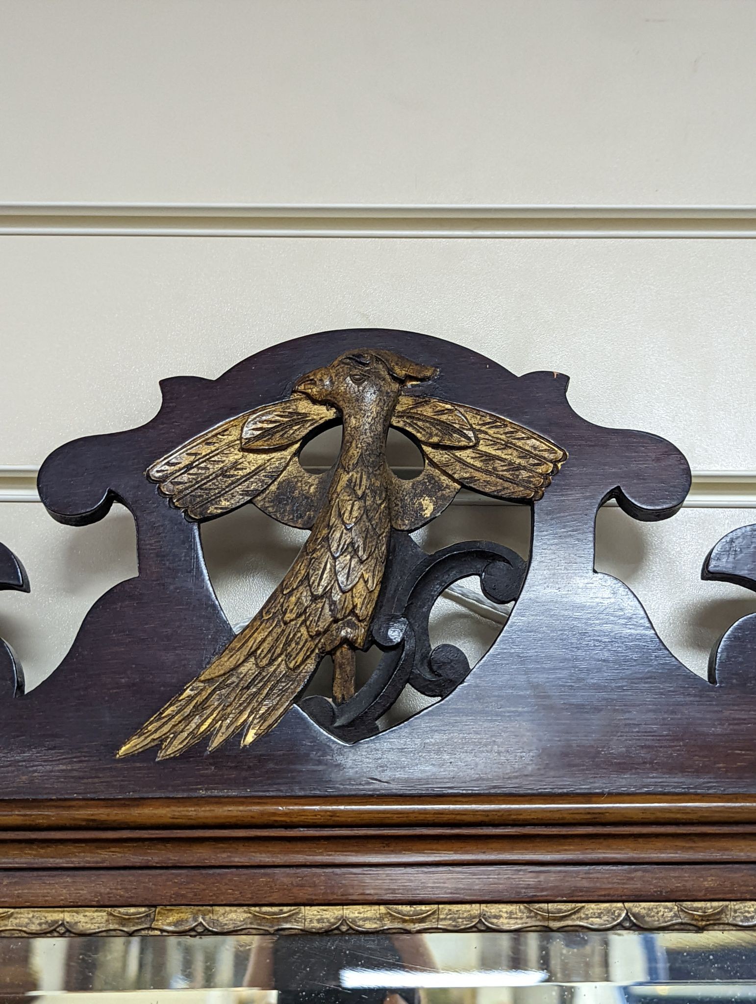 An Edwardian George III style mahogany fret cut triple plate overmantel mirror, width 116cm, height 86cm